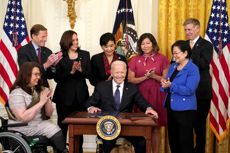 Image: President Joe Biden prepares to sign the COVID-19 Hate Crimes Act into law during a ceremony in the East Room at the White House on May 20, 2021.