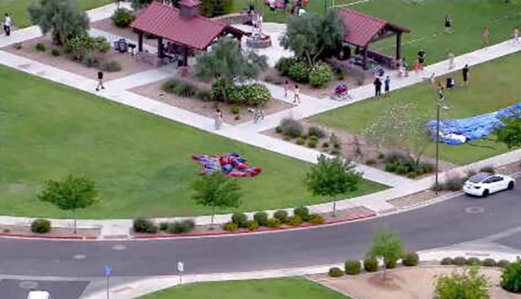 Image: Four children were injured after wind gusts sent a bounce house airborne in Arizona.