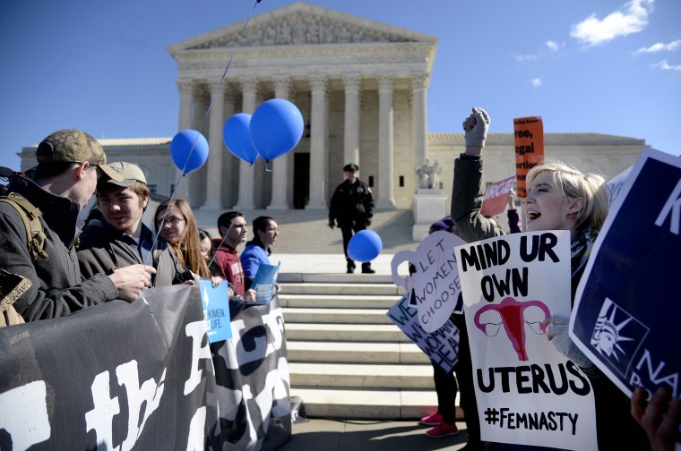 Supporters of legal access to abortion, as well as anti-abortion activists, rally outside the Supreme Court in Washington on March 2, 2016.