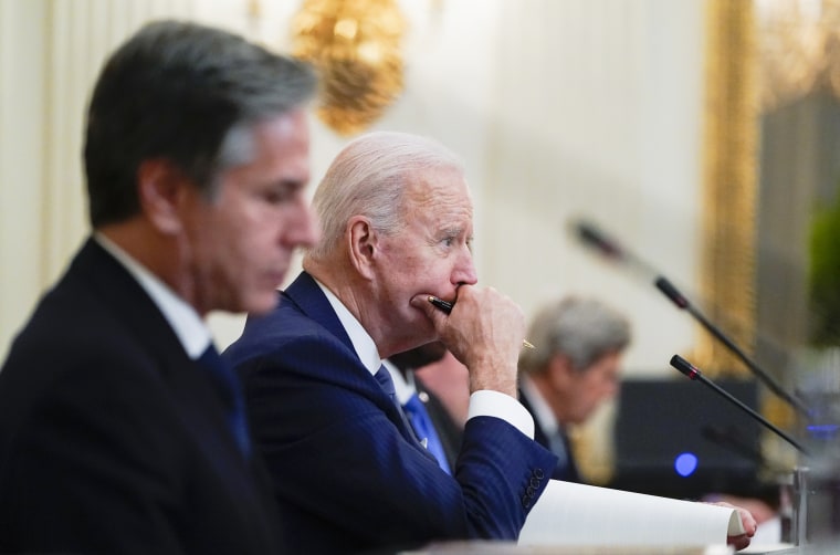 President Joe Biden attends a meeting with South Korean President Moon Jae-in alongside Secretary of State Antony Blinken, left, in the State Dinning Room of the White House on May 21, 2021.