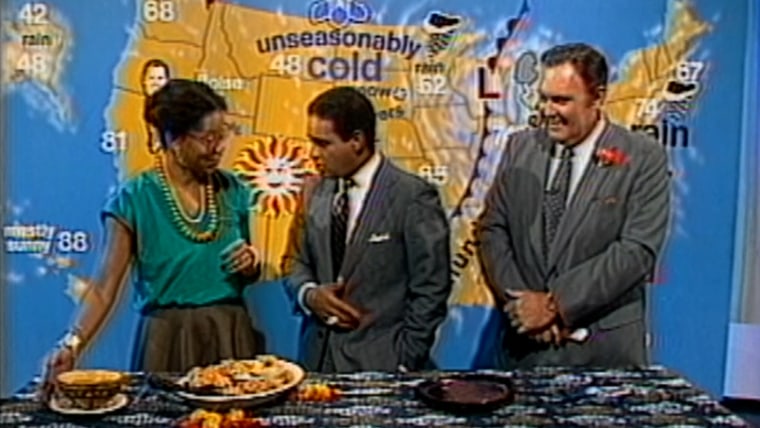 Harris presenting her chicken yassa to Bryant Gumbel and Willard Scott on TODAY in 1985.