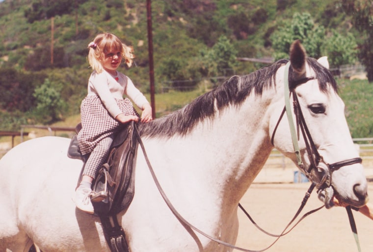 Gillian on one of her first horses as a young girl.