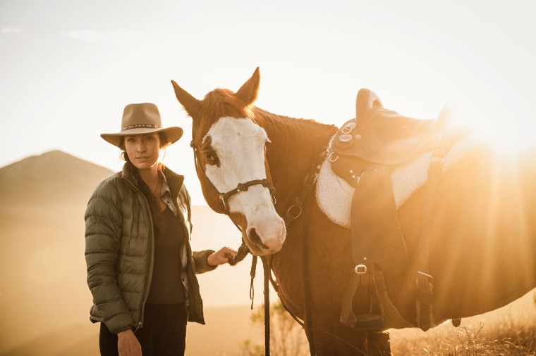 Larson with her horse on the trail