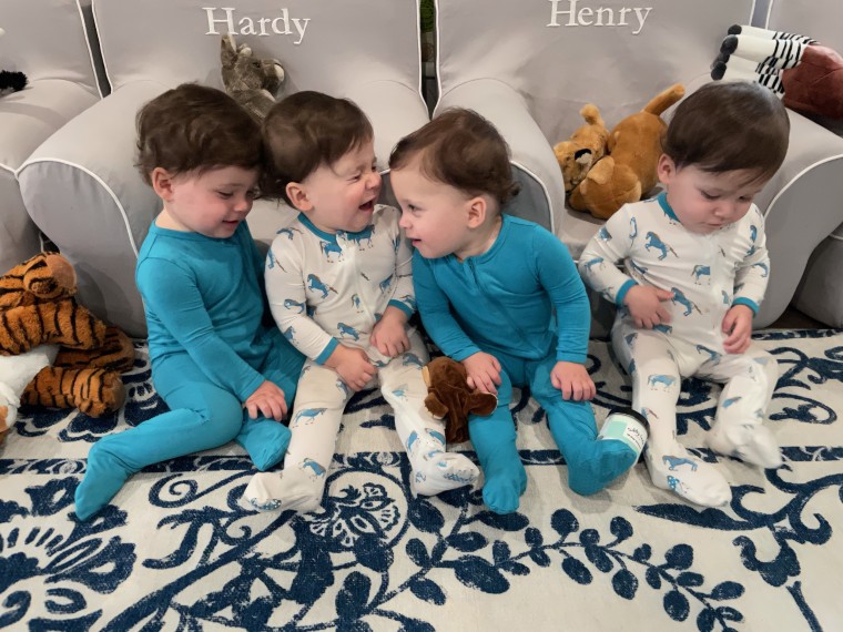 The boys, who turned 1 in March, love to play with the dog and eat. Now they're crawling everywhere as their parents struggle to keep up. 