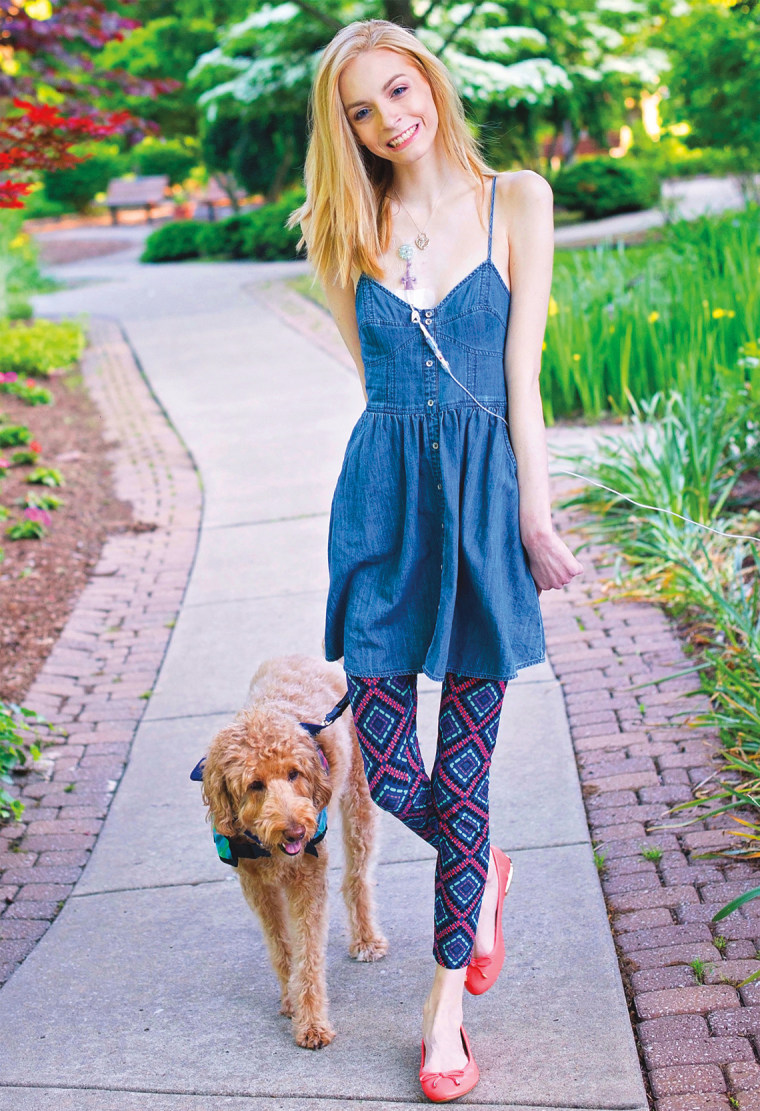 Sarah Kate Frey walks with her service dog, Alice Eloise.