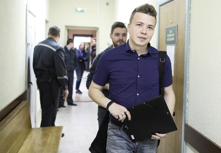 Image: Opposition blogger and activist Roman Protasevich arrives for a court hearing in Minsk