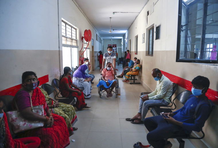 Image: A patient infected with black fungus is taken on a wheel chair for treatment at the Mucormycosis ward of a government hospital in Hyderabad, India