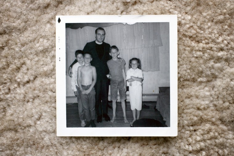 Father Richard Lavigne with Joe Croteau (under his arm) Danny Croteau (second from left) Michael Croteau (second from right) and their sister Jackie Croteau, in a photo from 1968, pictured in Springfield, Mass., on Oct. 24, 2003.