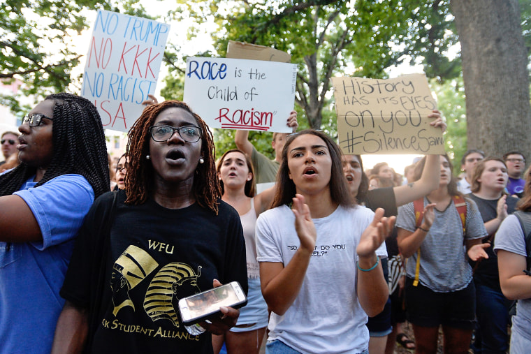 Demonstrators rally for the removal of a Confederate statue coined Silent Sam on the campus of the University of Chapel Hill on Aug. 22, 2017 in Chapel Hill N.C.