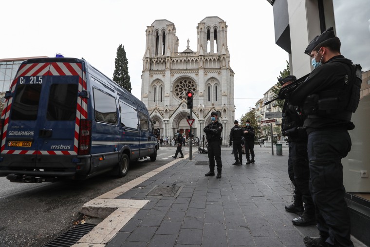 Image: French gendarmes secure the area around the Notre-Dame de l'Assomption Basilica in Nice.