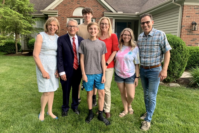 Vax-a-Million winner scholarship Joseph Costello, center, with his family and Ohio Gov. Mike DeWine and his wife, left.