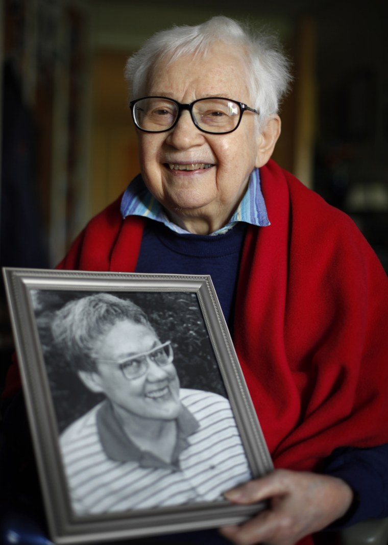 Kay Tobin Lahusen holds a portrait of her late partner, Barbara Gittings, in 2012.
