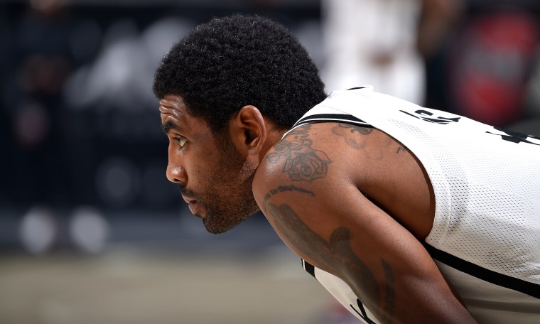 Image: Kyrie Irving of the Brooklyn Nets looks on during a game.