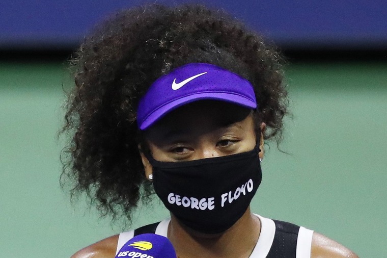 Image: Naomi Osaka of Japan wears a mask with the name of George Floyd on it during an interview  following her Women's Singles quarter-finals match win on Day Nine of the 2020 US Open.