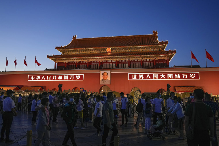 Image: Visitors tour in front of Tiananmen Gate on the eve of the June 4 anniversary in Beijing