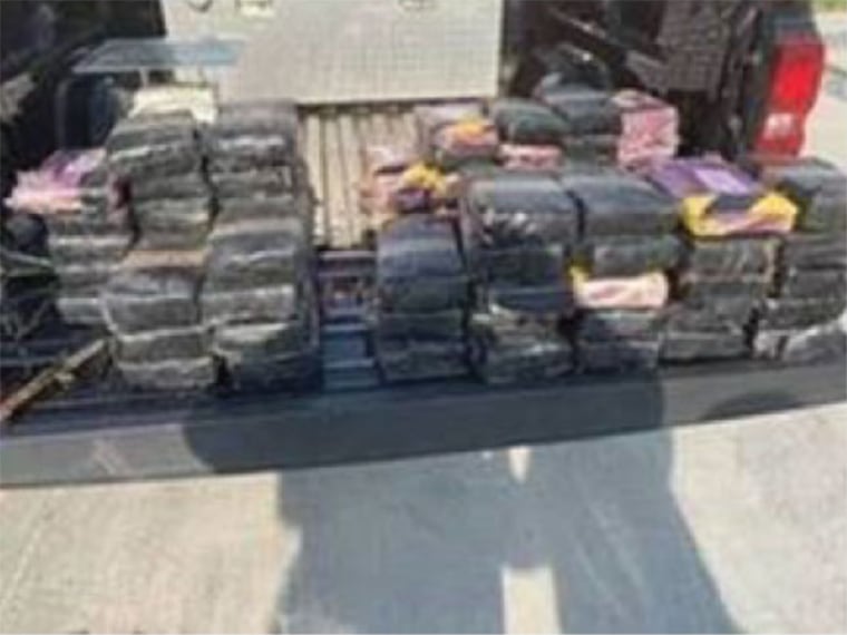 Image: Troopers discovered three burlap sacks holding a combined total of 70 bundles of cocaine in the back of a BMW SUV after a two-vehicle crash near Rio Grande City, Texas on May 31, 2021. The drugs weighed an estimated 182 pounds and have a street val