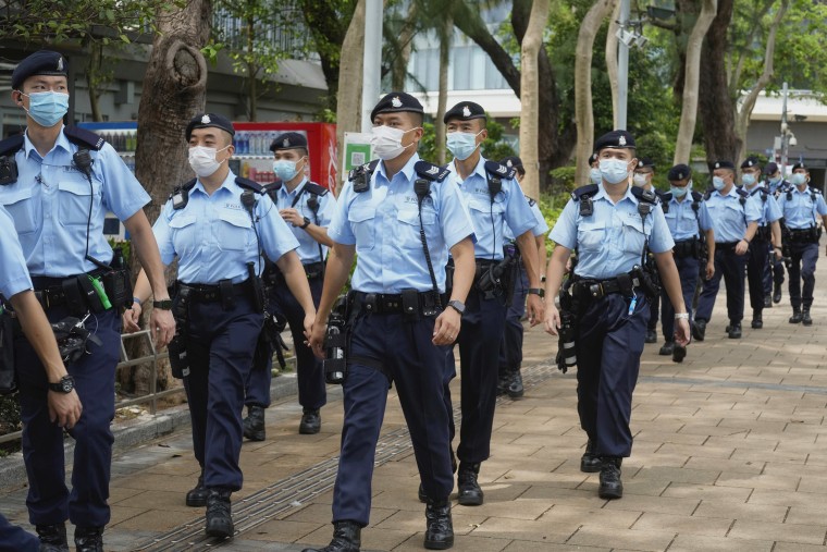 Image: Police officers walk in Victoria Park in Hong Kong