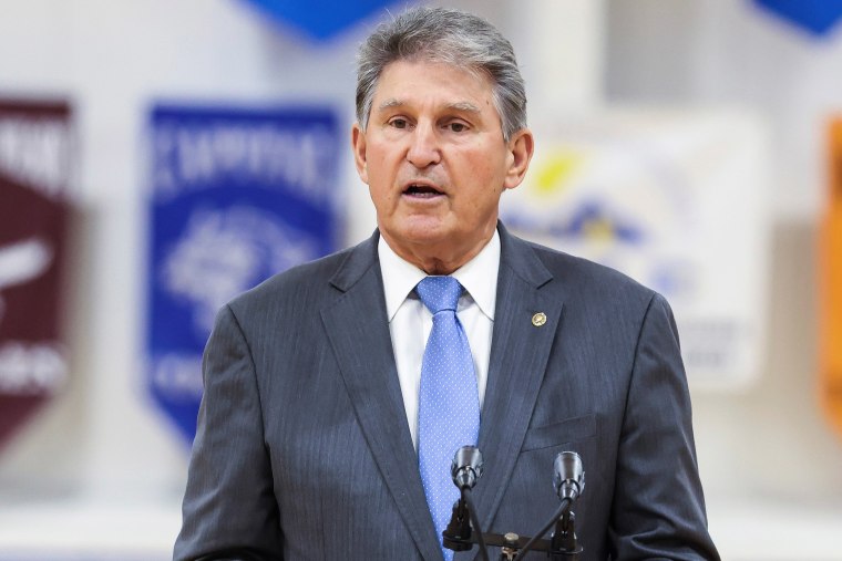 Image: Sen. Joe Manchin, D-WV., speaks during a visit of U.S. first lady Jill Biden to a vaccination centre at Capital High School in Charleston