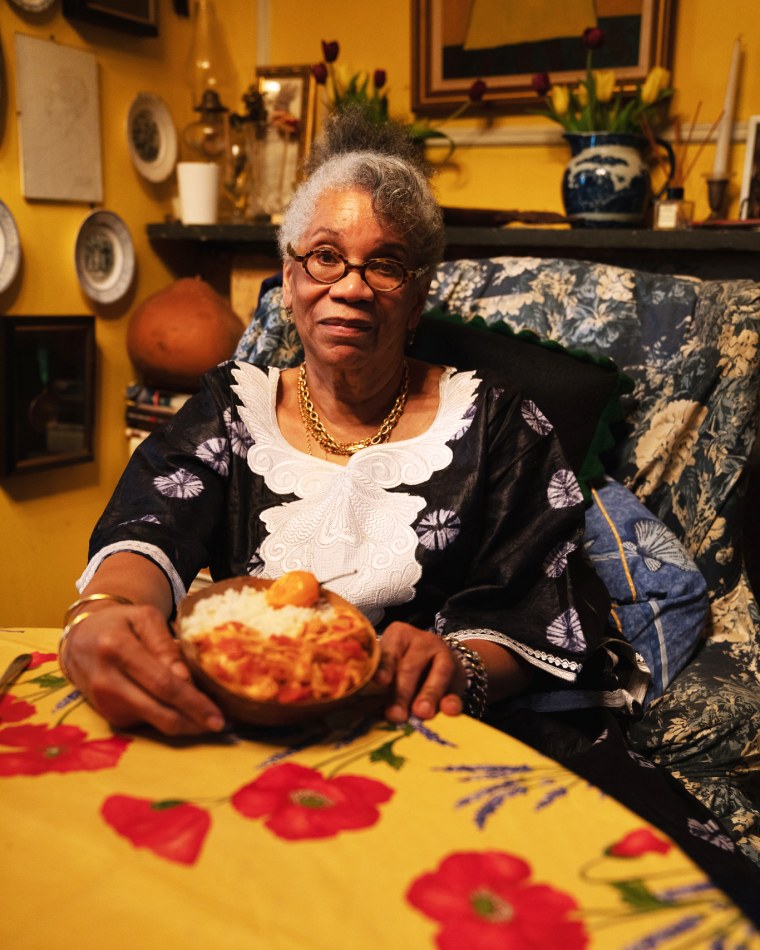 Harris with her finished moyo de poulet fume at her home in Brooklyn, New York.