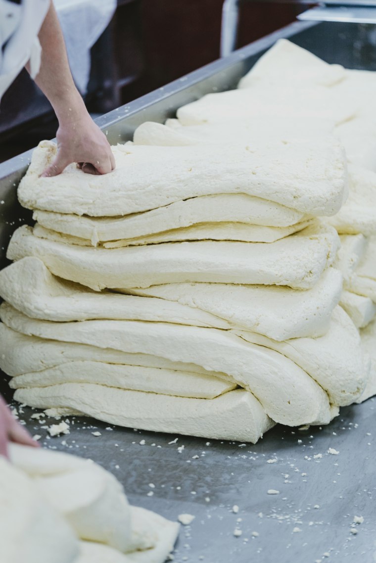 Curds being made for cheddar at Quicke's Farm in the U.K.