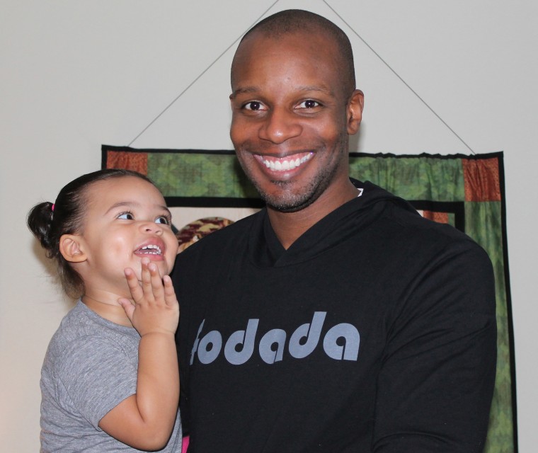 Doyin Richards is all smiles with one of his daughters.