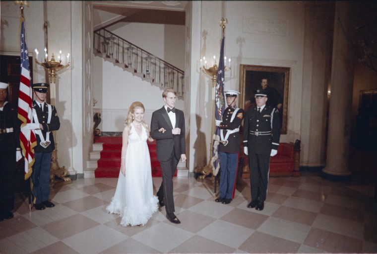 Tricia Nixon and Edward Cox entering the Grand Hall of the White House ahead of the official engagement announcement on March 16, 1971.