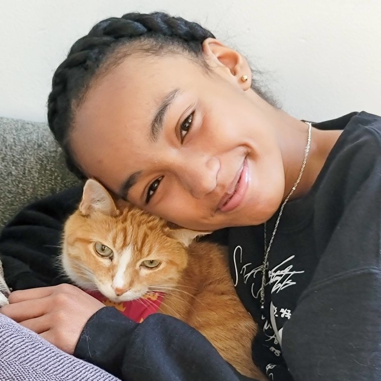 Ava Dorsey and her cat, Pumpkin