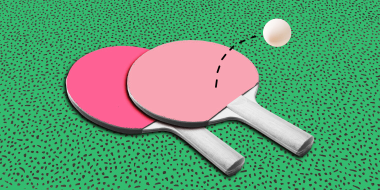 Ping pong paddles on green background