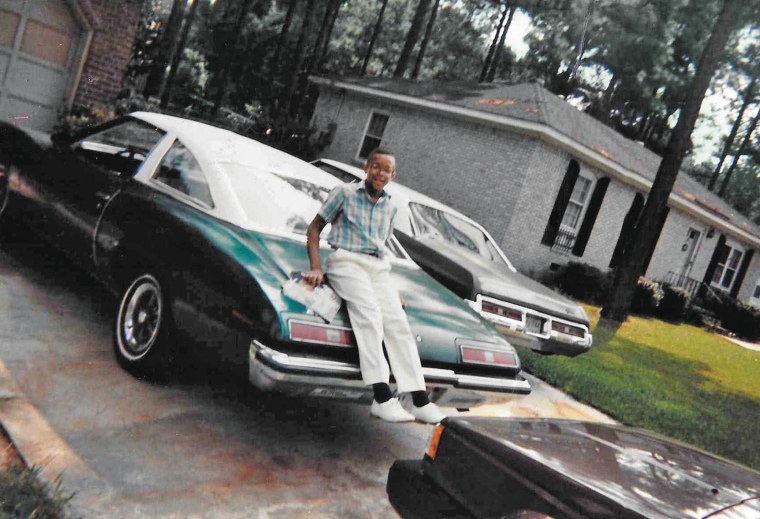 A young Craig Melvin on his dad's 1973 Pontiac LeMans. Tinkering with the car was one of the few ways Melvin bonded with his dad, Lawrence. 