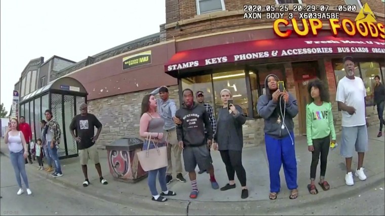 Darnella Frazier, third from right, films as former Minneapolis police officer Derek Chauvin presses his knee on George Floyd's neck for several minutes in Minneapoli on May 25, 2020.