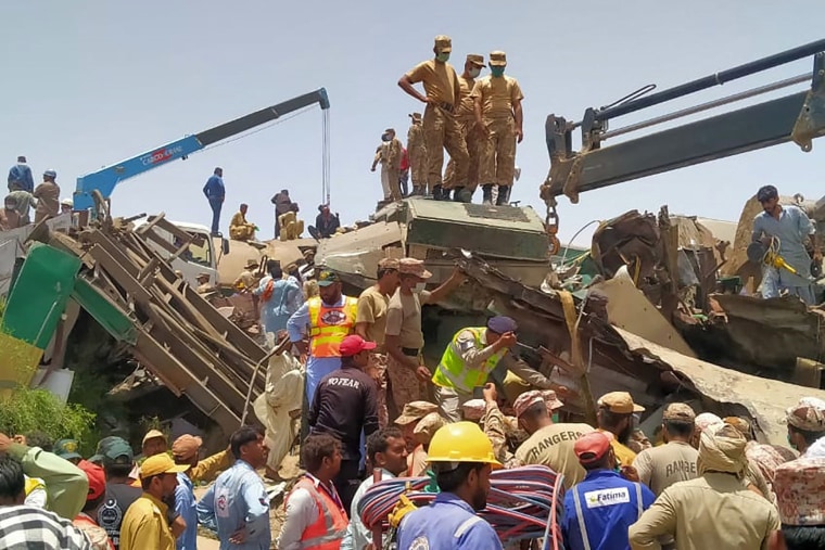 Image: A rescue was underway on Monday after a train crashed into the derailed cars of a second train in Pakistan.