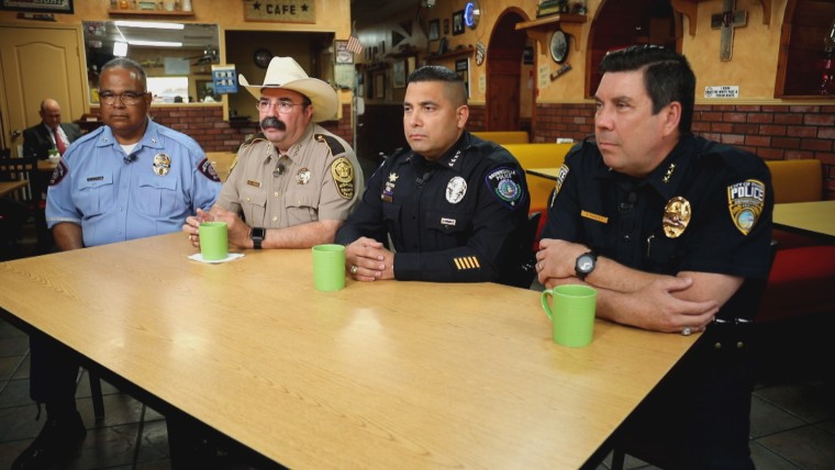 McAllen Police Chief Victor Rodriguez, left, Hidalgo County Sherriff Eddie Guerra, second from left, Brownsville Police Chief Felix Sauceda and Pharr Police Chief Andy Harvey, right, meet for breakfast at the Junction Caf? on May 26, 2021, to talk about h