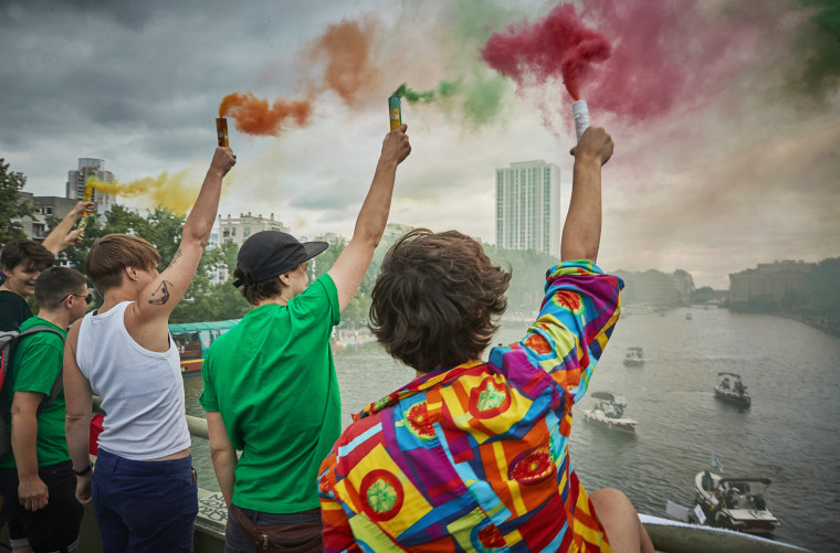 Image:; Revelers hold flayers during unofficial Gay Pride celebrations despite cancellation of the event in Paris on June 27, 2020.