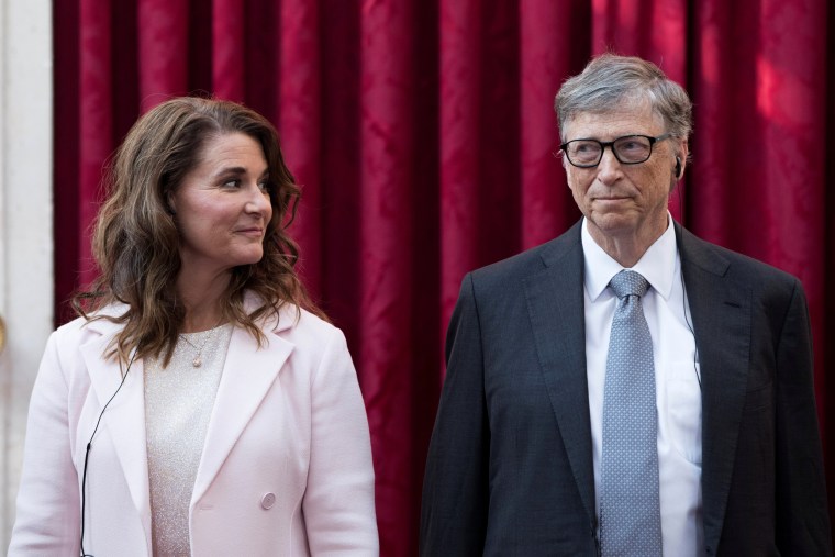 Image: Philanthropist and co-founder of Microsoft, Bill Gates and his wife Melinda listen to the speech by French President Francois Hollande, prior to being awarded Commanders of the Legion of Honor at the Elysee Palace in Paris