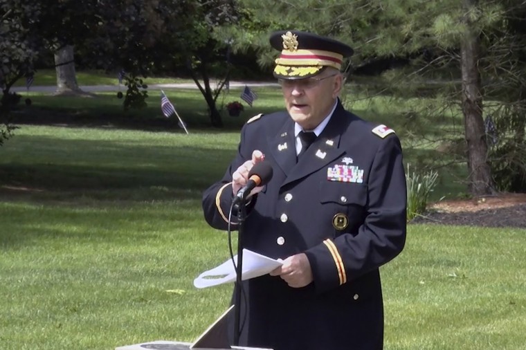 Image: Retired Army Lt. Col. Barnard Kemter taps the microphone after organizers turned off the audio during his speech at a Memorial Day ceremony