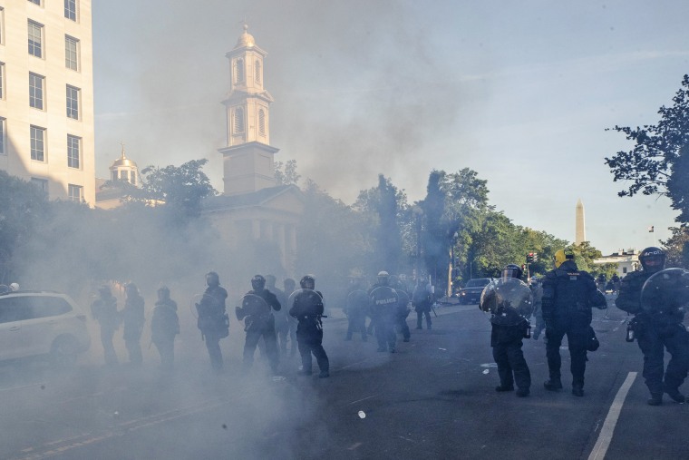 Police move demonstrators away from St. John's Church across Lafayette Park from the White House on June 1, 2020.