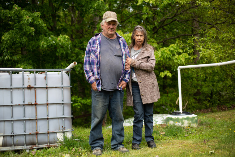 Burl and Delphine Stacy live on a mountain ridge, just one mile from a public water line, but have to rely on rainwater and bottled water to drink, wash and cook with.