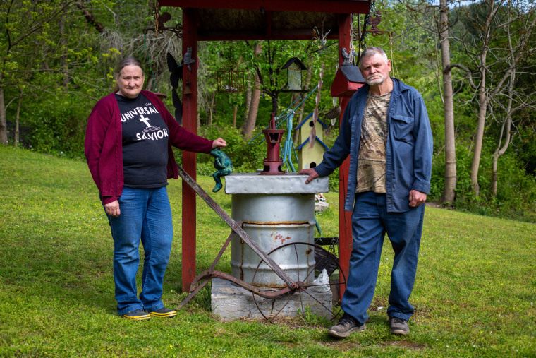 Hazel and Burlyn Cooper stand near their hand-dug well, one of two wells on their property that went bad after a natural gas well was installed nearby.