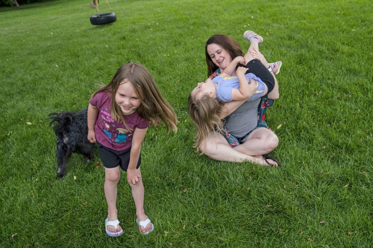 After working from home with spotty child care throughout the pandemic, \"I have learned that I can pretty much parent through anything,\" Annie Whitlock, seen with her daughters, Maggie, 6, and McKenzie, 3, said.