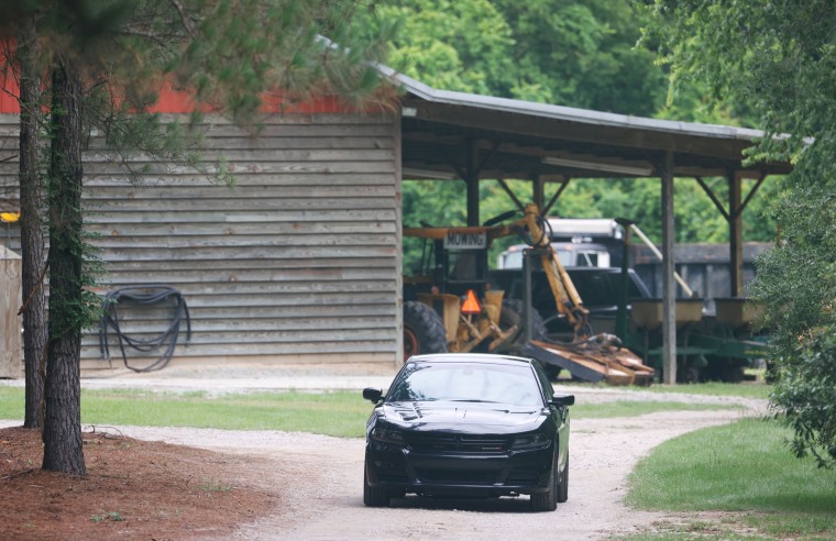 A vehicle sits in the driveway of a home on June 8, 2021, in rural Colleton County, near Islandton, S.C.