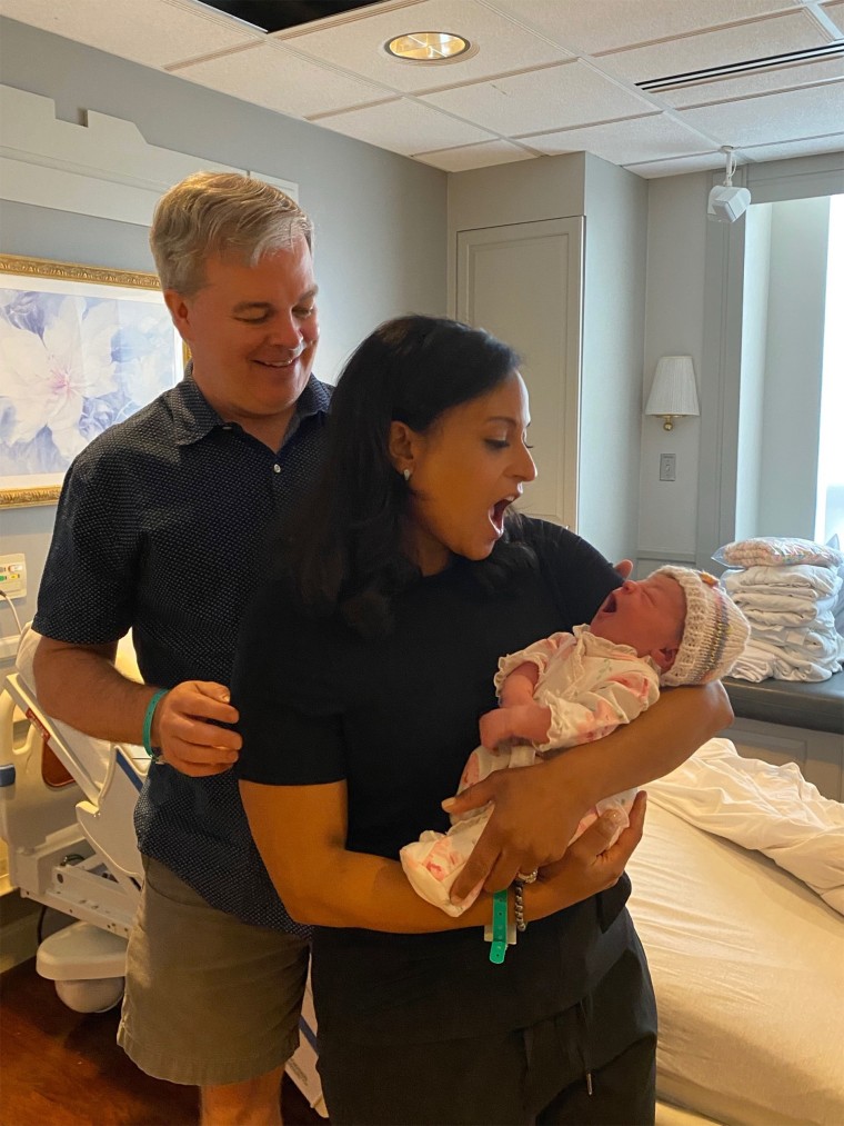 Kristen Welker and husband John Hughes with baby Margot.