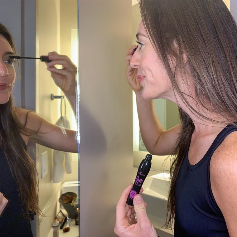 Shop TODAY contributor Katie Jackson looking in the mirror and applying the new Essence Mascara