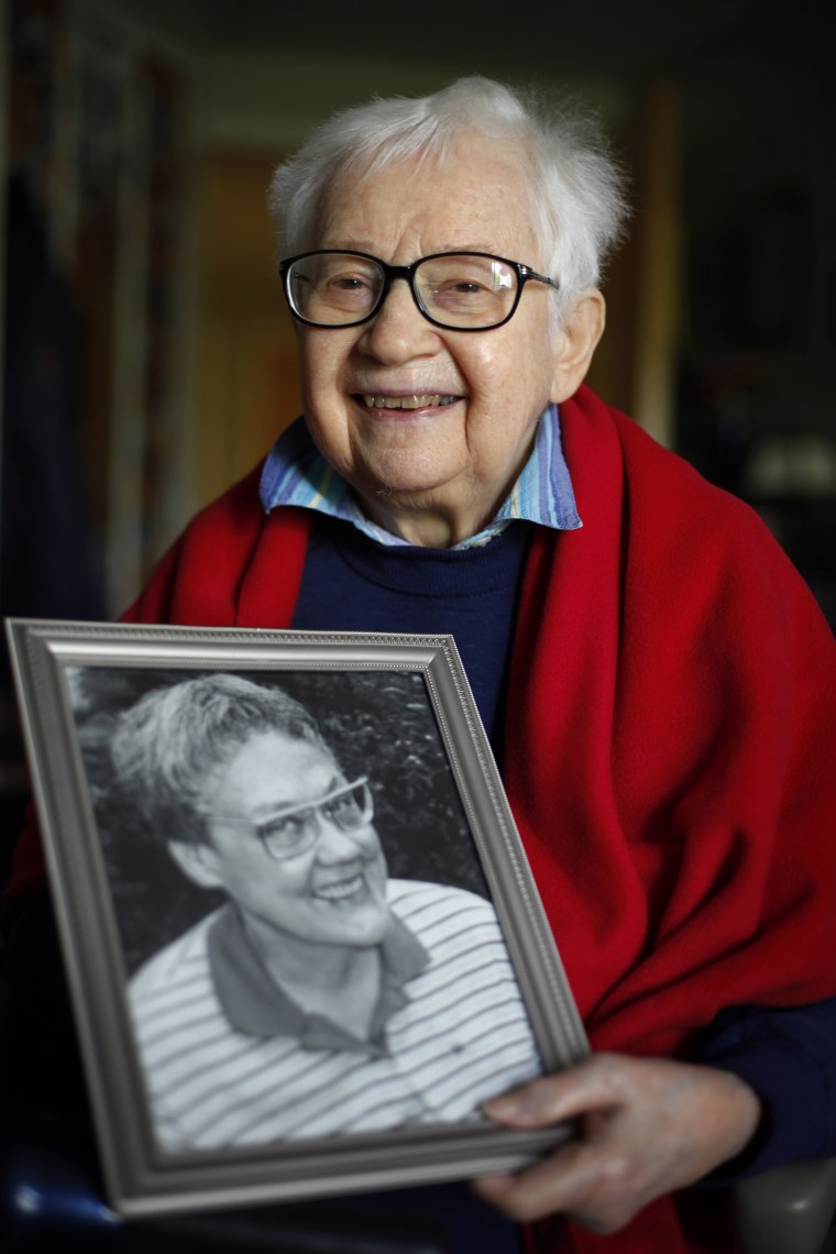 Kay Tobin Lahusen poses with a portrait of her late partner Barbara Gittings, in Kennett Square, Pennsylvania, in May 2012. According to Baim's book, it was Lahusen's favorite photo she ever took of Gittings.