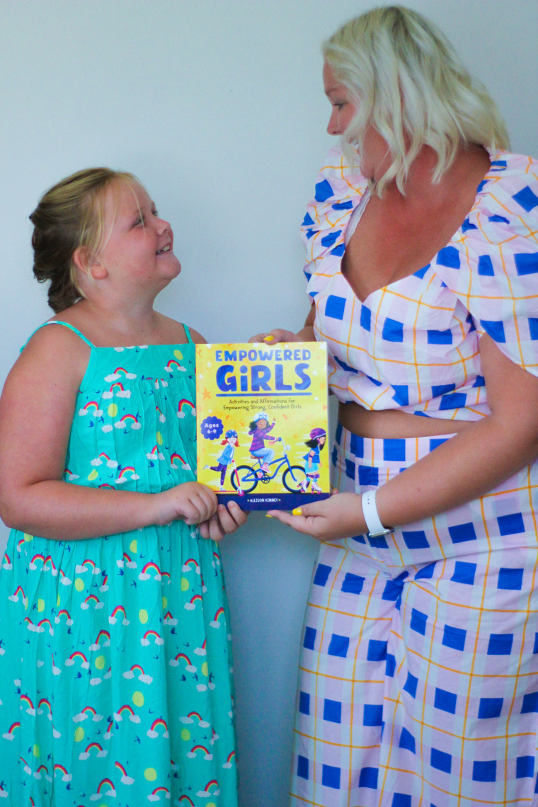 Kimmey and her daughter, Cambelle, with her new book, "Empowered Girls."