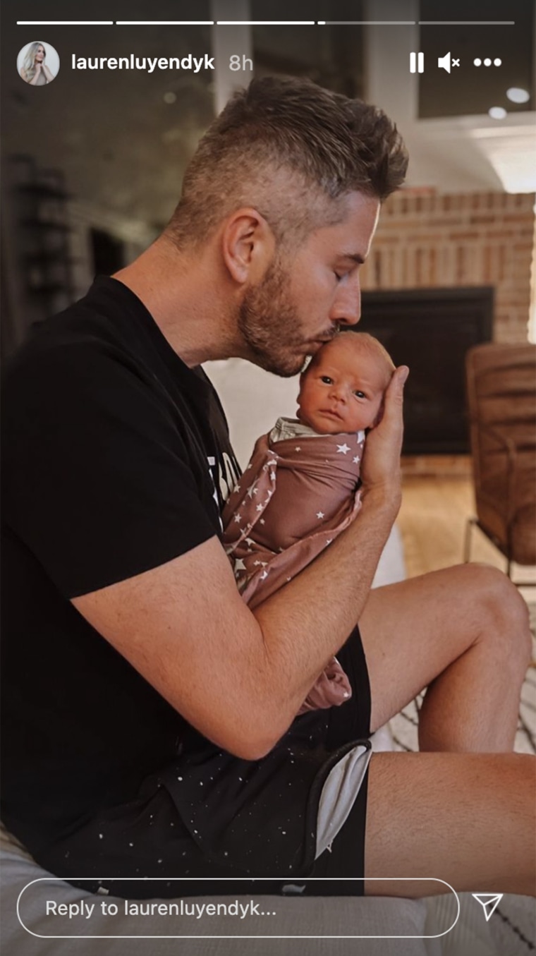 Arie Luyendyk Jr. posed with his newborn son Lux. 