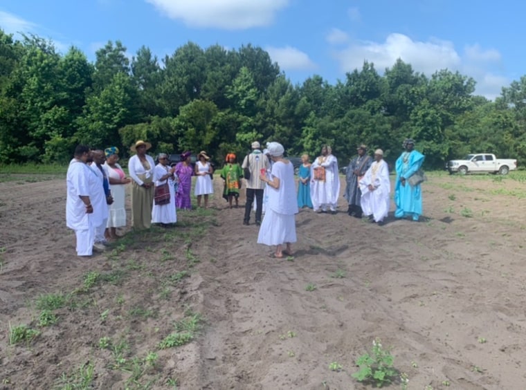 Lipscombe's land being blessed by elders from the community, her distant relatives and others, including Michael Twitty, Mashama Bailey and David and Tonya Thomas.