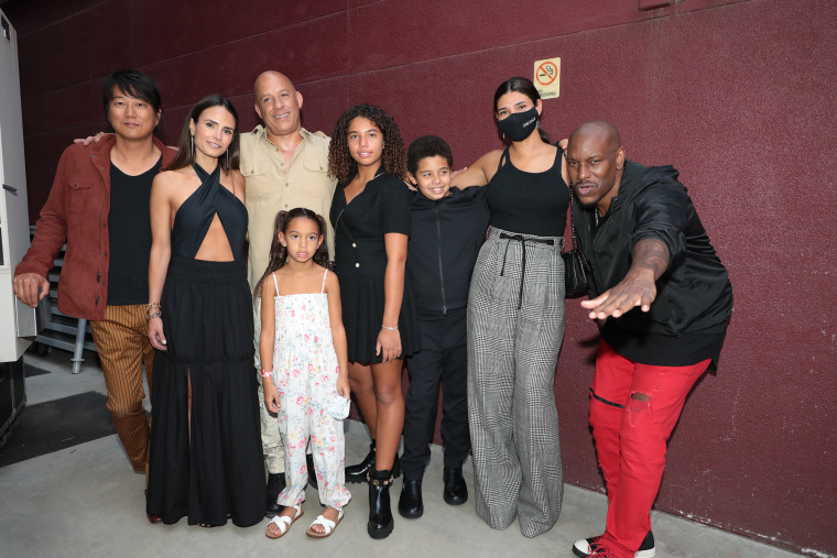 Diesel's co-stars, Sung Kang, Jordana Brewster and Tyrese Gibson, take a photo with his real-life family.
