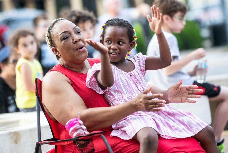 Doris Watkins, left, claps with her granddaughter, Zawadi Odhiambo, 4, during a Juneteenth celebration in Florence, Alabama.