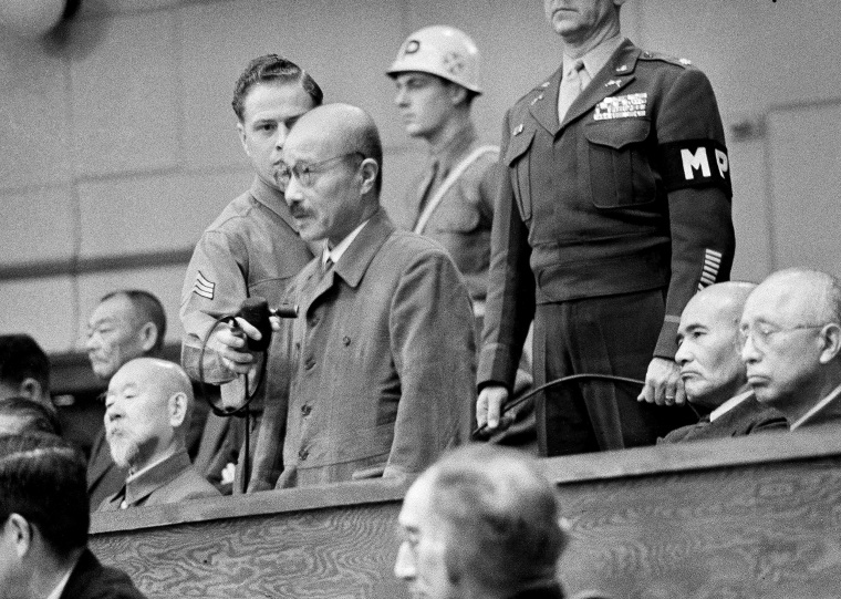 Image: Former Japanese Prime Minister Hideki Tojo answers "not guilty" during a war crimes trial in Tokyo in November, 1948. 