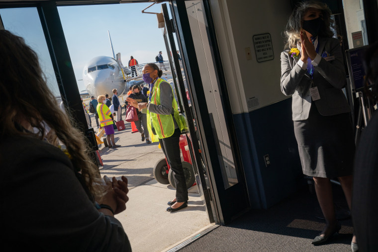 Image: Avelo Airlines employees greet arriving passengers disembarking at Hollywood Burbank Airport on April 28, 2021.